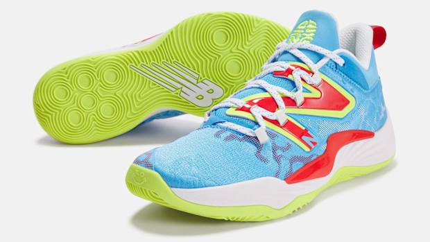 View of blue, red, and green New Balance shoes.